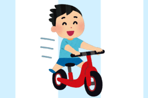 自転車に乗る練習をする子供